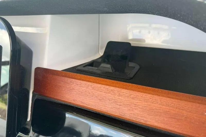 Slide: The Image of Interior detail of 2026 Monterey Elite 30 OB, featuring sleek wood and black accents. - 80