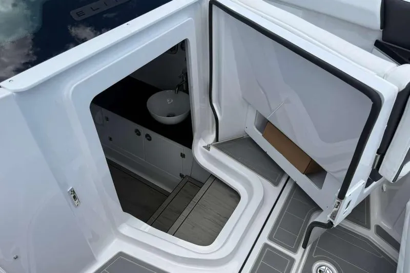 Slide: The Image of Interior view of 2026 Monterey Elite 30 OB boat, featuring a compact sink and modern design. - 28