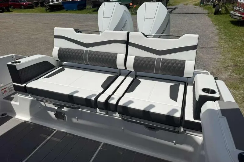 Slide: The Image of 2026 Monterey Elite 30 OB boat seating with modern design and cup holders. - 60