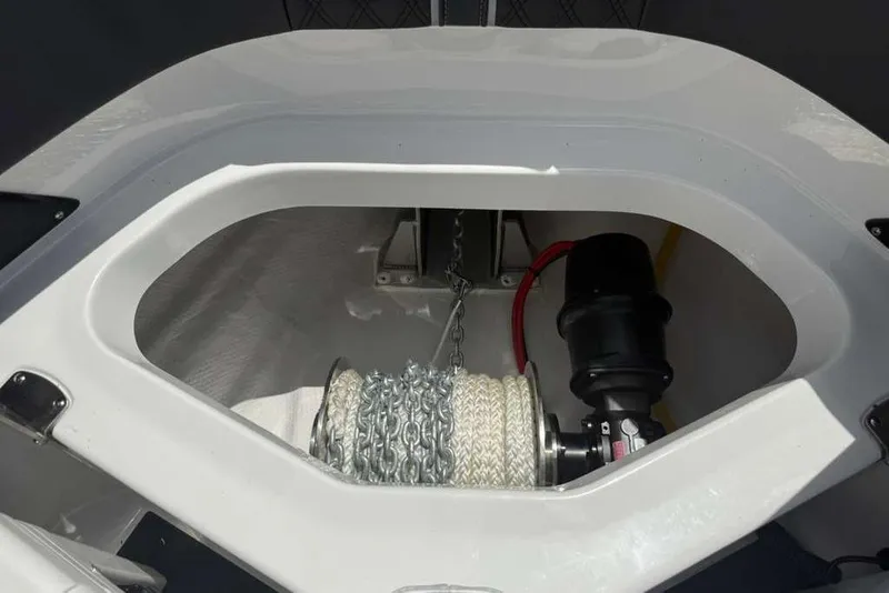 Slide: The Image of Anchor compartment of 2026 Monterey Elite 30 OB boat with chain and rope. - 44