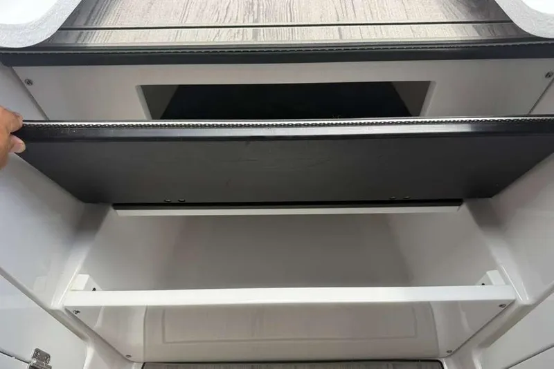 Slide: The Image of Storage compartment in 2026 Monterey Elite 30 OB boat, featuring sleek design and ample space. - 30