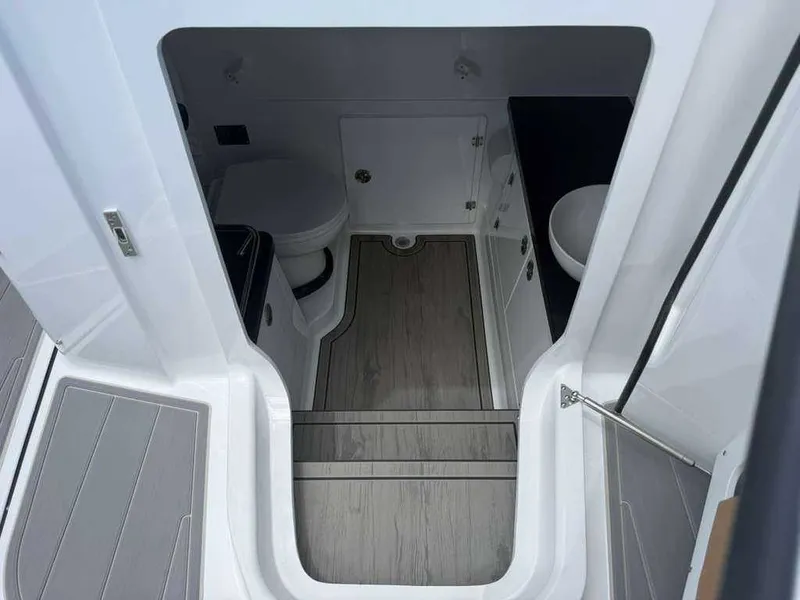 Slide: The Image of Interior of the Monterey Elite 30 OB with toilet and sink. - 23