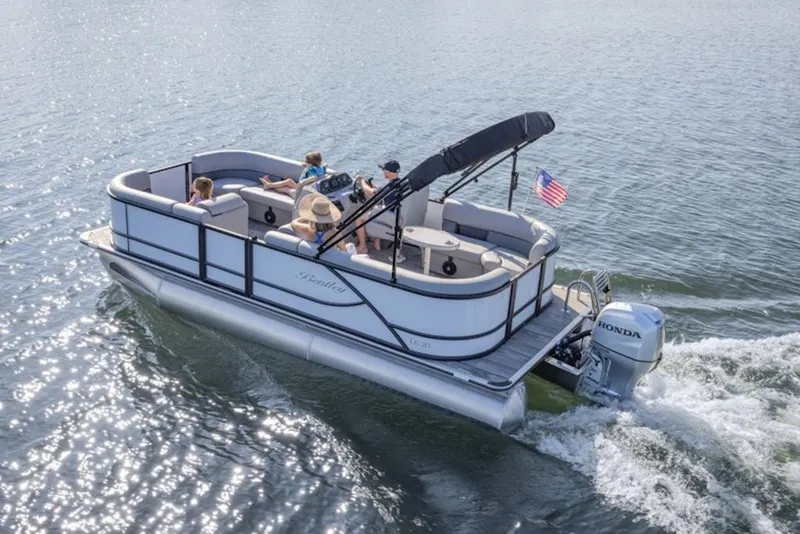 Slide: The Image of 2026 Bentley Pontoons LE 200 CR cruising on a lake with passengers enjoying the ride. - 6