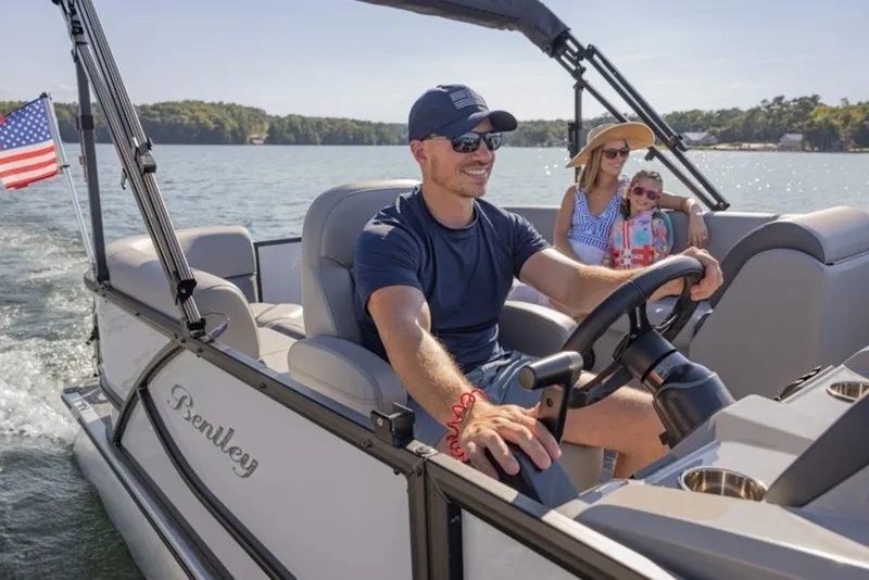 Slide: The Image of 2026 Bentley Pontoons LE 200 CR on a lake with passengers enjoying a sunny day. - 7