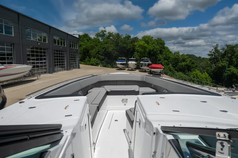 Slide: The Image of 2026 Monterey 385SS Super Sport boat docked, showcasing spacious seating and sleek design. - 19