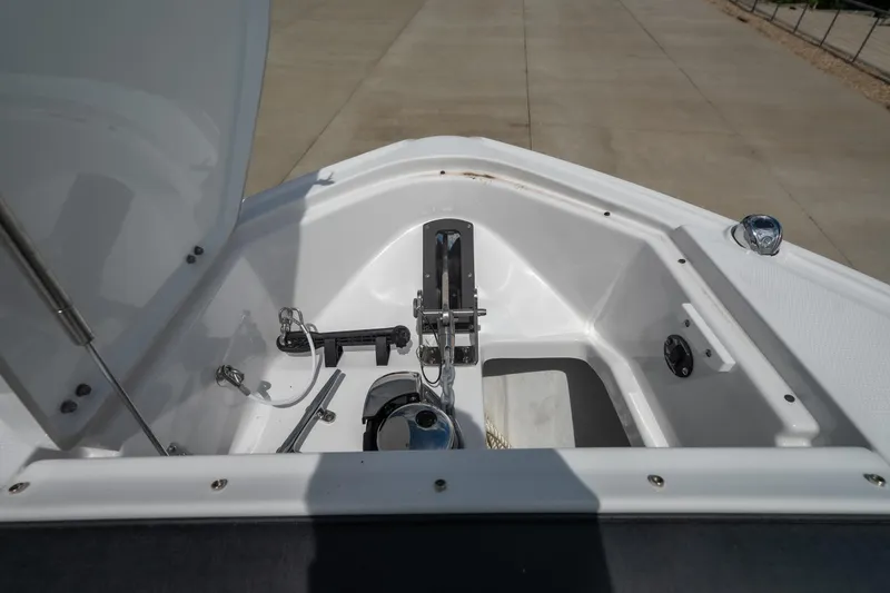 Slide: The Image of Anchor compartment of 2026 Monterey 385SS Super Sport boat, showcasing storage and equipment. - 23