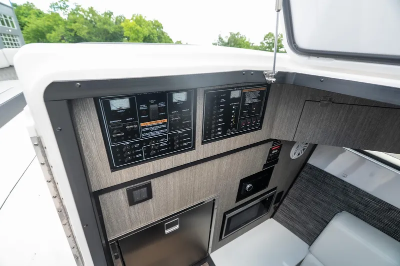 Slide: The Image of Control panel of 2026 Monterey 385SS Super Sport boat, featuring modern navigation and system controls. - 27
