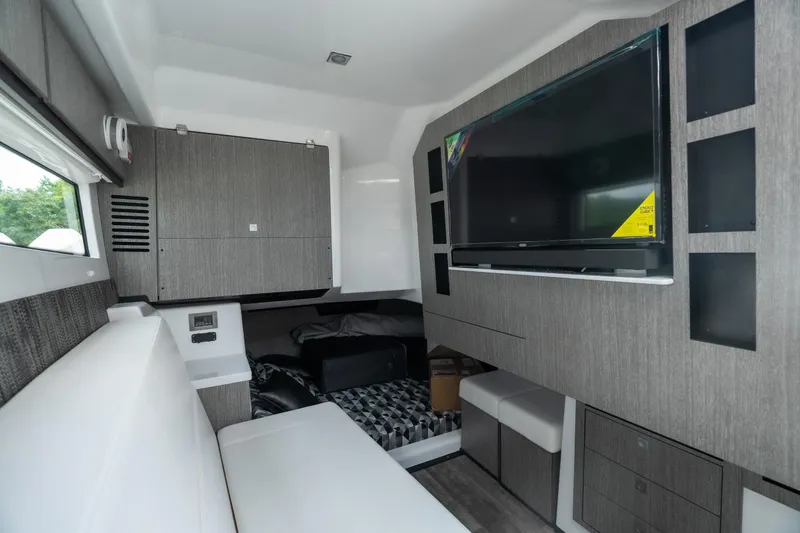 Slide: The Image of Interior of 2026 Monterey 385SS Super Sport boat with modern seating and entertainment system. - 29