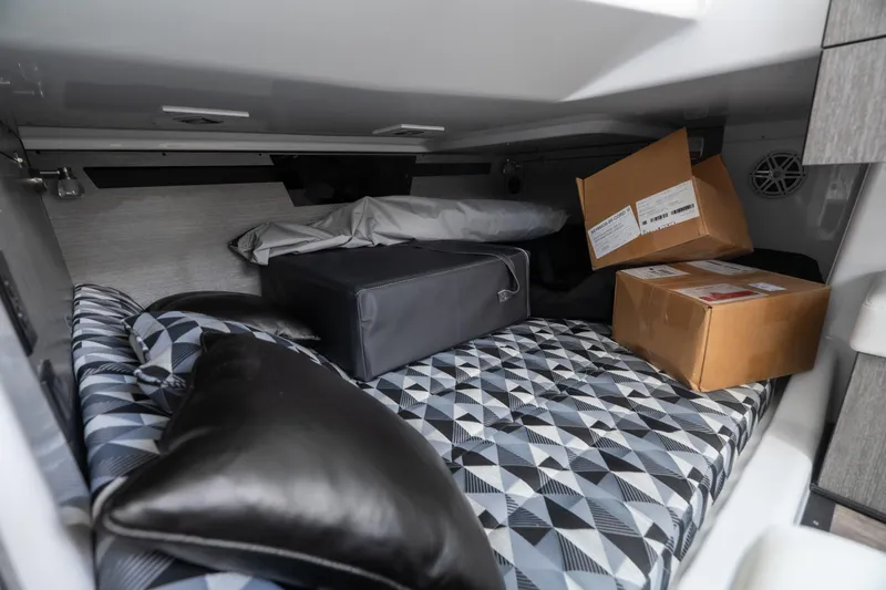 Slide: The Image of Interior cabin of 2026 Monterey 385SS Super Sport with storage boxes and patterned bedding. - 30