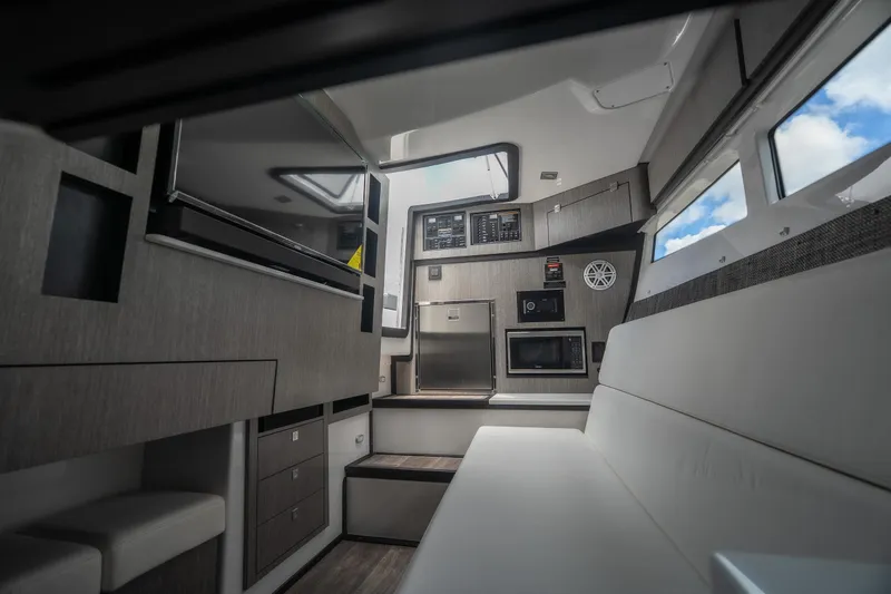 Slide: The Image of Interior of 2026 Monterey 385SS Super Sport boat with modern amenities and sleek design. - 31