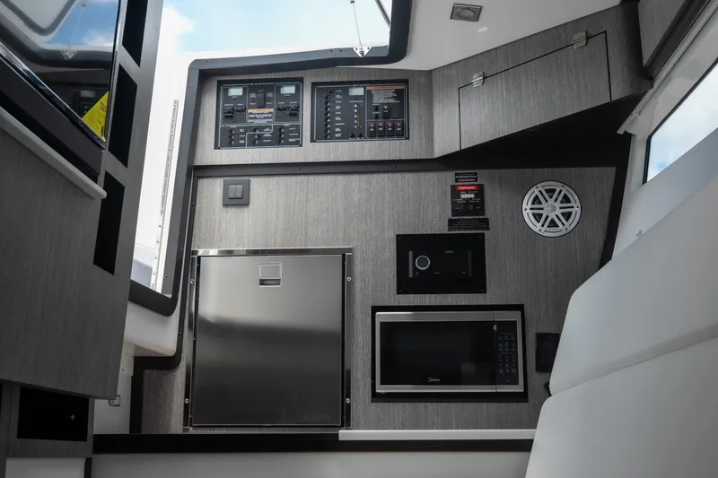 Slide: The Image of Interior of 2026 Monterey 385SS Super Sport boat with modern appliances and control panels. - 32