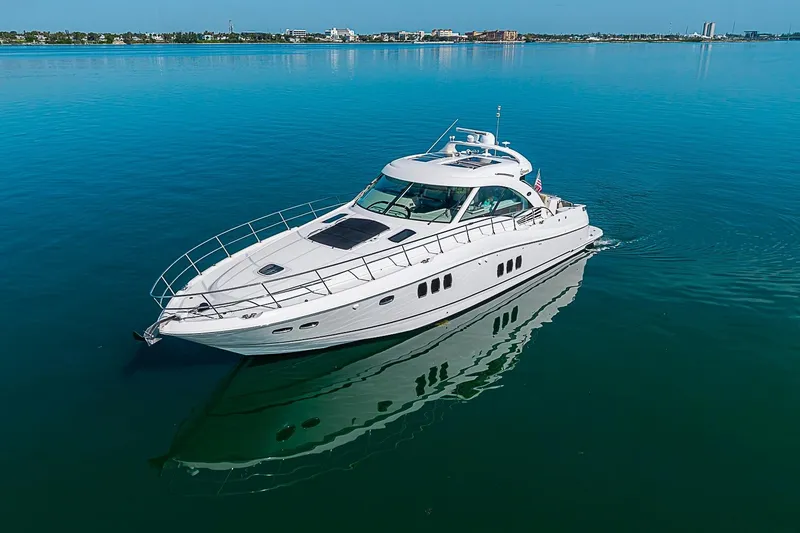 Slide: The Image of 2008 Sea Ray 60 Sundancer yacht cruising on calm blue waters. - 8