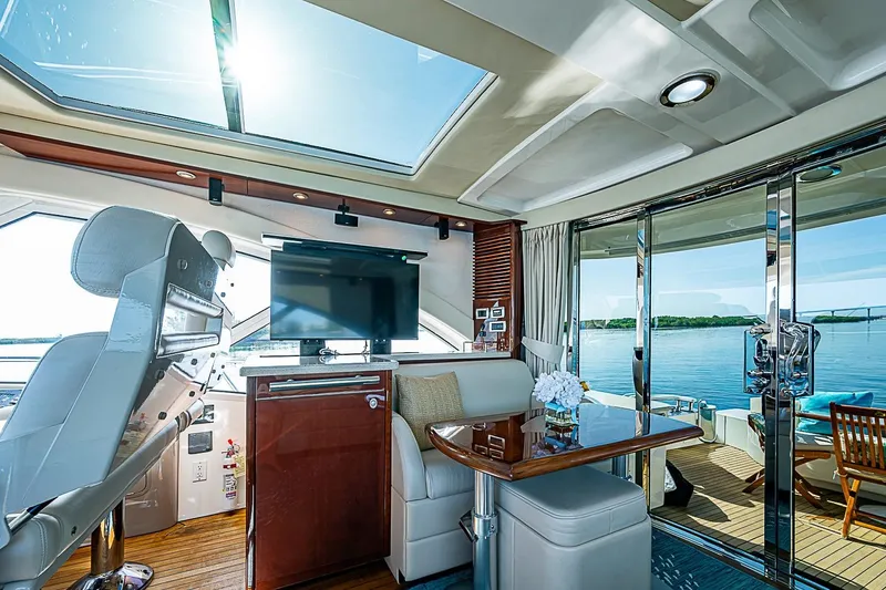 Slide: The Image of Luxurious interior of 2008 Sea Ray 60 Sundancer yacht with panoramic views and elegant furnishings. - 24