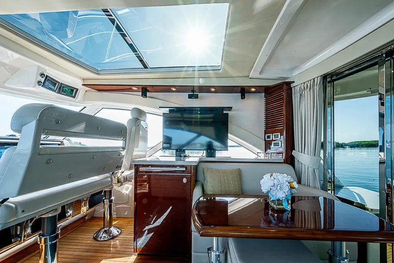 Slide: The Image of Luxurious interior of 2008 Sea Ray 60 Sundancer yacht with skylight and elegant seating. - 23