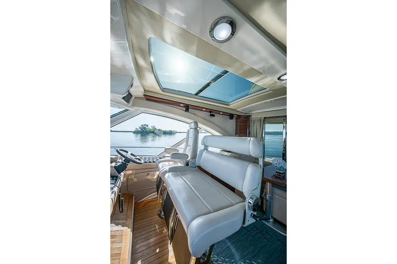 Slide: The Image of Luxurious interior of 2008 Sea Ray 60 Sundancer yacht with panoramic windows and plush seating. - 21
