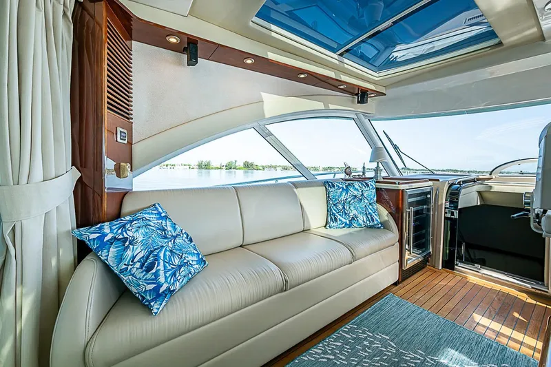 Slide: The Image of Luxurious interior of 2008 Sea Ray 60 Sundancer yacht with leather seating and blue accents. - 27