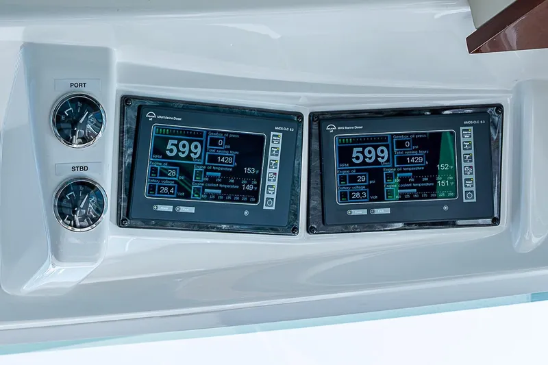 Slide: The Image of Dashboard of 2008 Sea Ray 60 Sundancer with dual digital displays and gauges. - 25