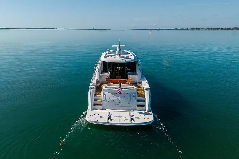 Slide: The Image of 2008 Sea Ray 60 Sundancer yacht cruising on calm blue waters. - 4
