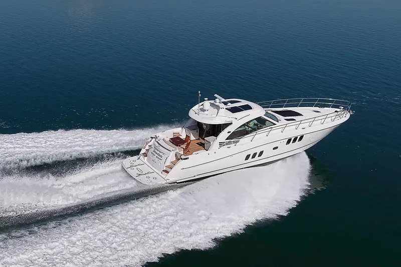 Slide: The Image of 2008 Sea Ray 60 Sundancer yacht cruising on open water, showcasing sleek design and performance. - 15