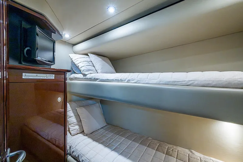 Slide: The Image of Luxurious 2008 Sea Ray 60 Sundancer yacht cabin with cozy bunk beds and modern amenities. - 48