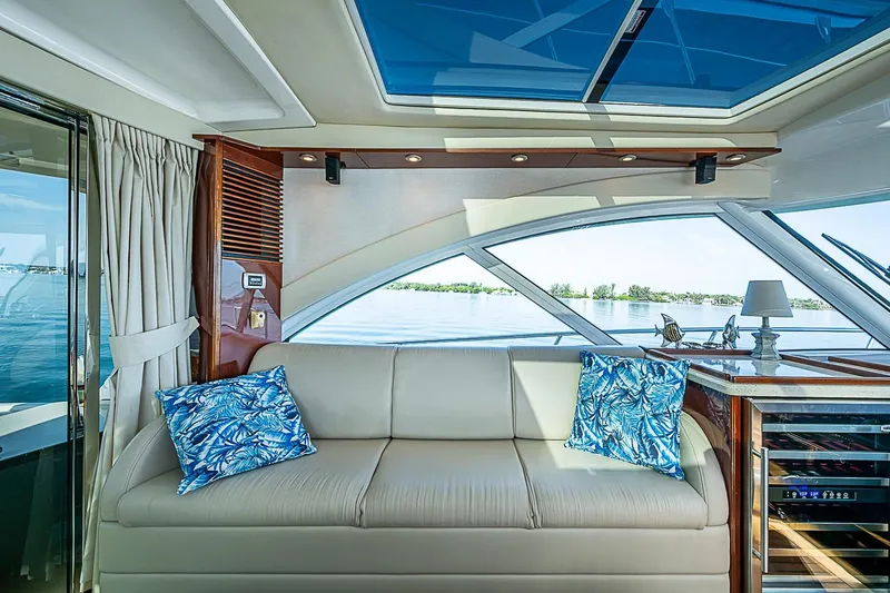 Slide: The Image of Luxurious interior of 2008 Sea Ray 60 Sundancer yacht with elegant seating and scenic water view. - 28