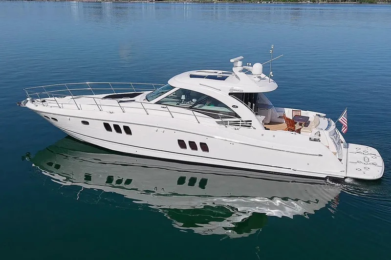 Slide: The Image of 2008 Sea Ray 60 Sundancer yacht cruising on calm blue waters. - 9