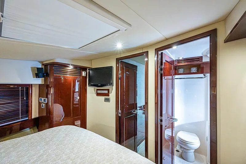 Slide: The Image of Luxurious 2008 Sea Ray 60 Sundancer yacht interior with bedroom and ensuite bathroom. - 44