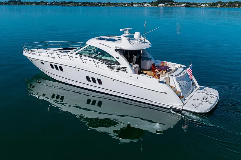Slide: The Image of 2008 Sea Ray 60 Sundancer yacht cruising on calm blue waters. - 6