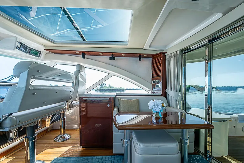 Slide: The Image of Luxurious interior of 2008 Sea Ray 60 Sundancer yacht with panoramic windows and elegant seating. - 22