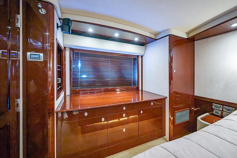 Slide: The Image of Luxurious interior of 2008 Sea Ray 60 Sundancer yacht with polished wood cabinetry. - 45