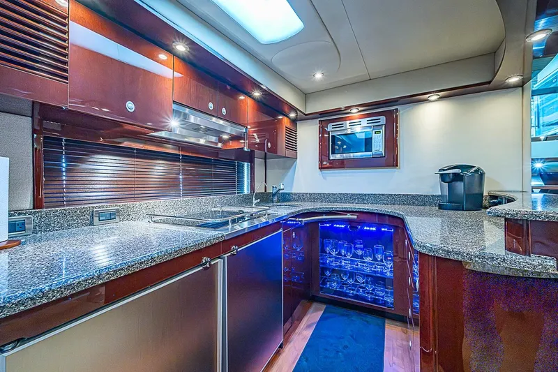 Slide: The Image of Luxurious kitchen interior of 2008 Sea Ray 60 Sundancer yacht with modern amenities. - 36
