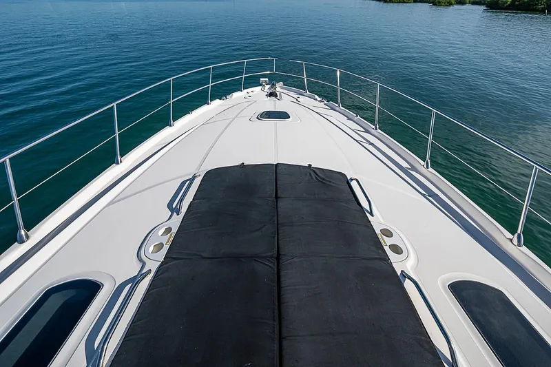 Slide: The Image of Bow view of 2008 Sea Ray 60 Sundancer yacht on calm water. - 57