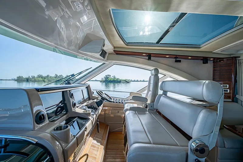 Slide: The Image of Luxurious interior of 2008 Sea Ray 60 Sundancer yacht with panoramic windows and plush seating. - 19