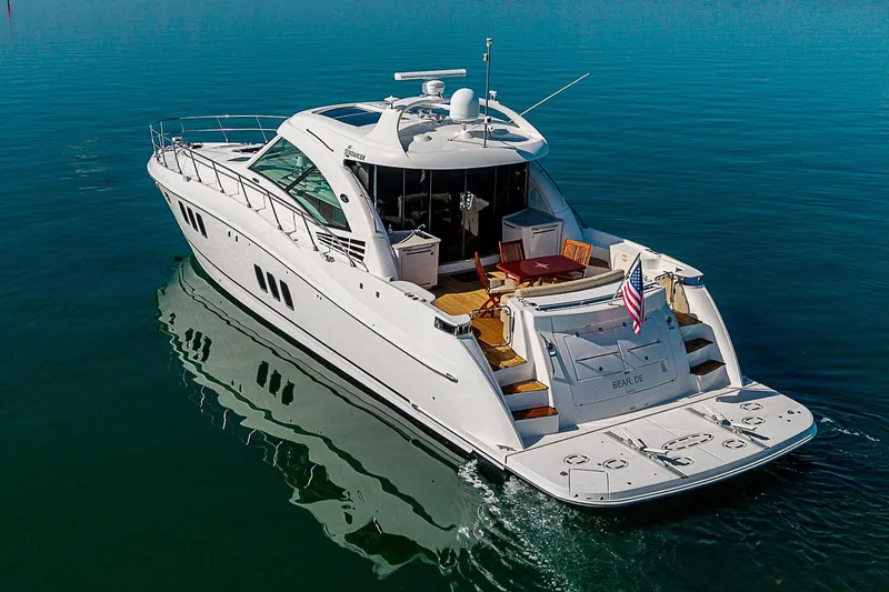 Slide: The Image of 2008 Sea Ray 60 Sundancer yacht cruising on calm blue waters. - 5