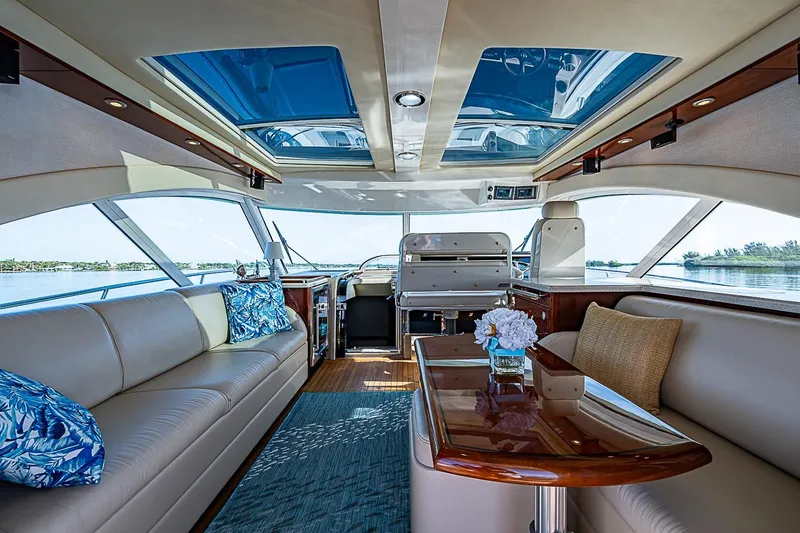 Slide: The Image of Luxurious interior of 2008 Sea Ray 60 Sundancer yacht with elegant seating and panoramic windows. - 26