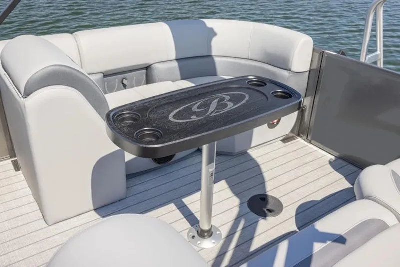 Slide: The Image of 2026 Bentley Pontoons Legacy 223 Cruise interior with seating and table on water. - 6