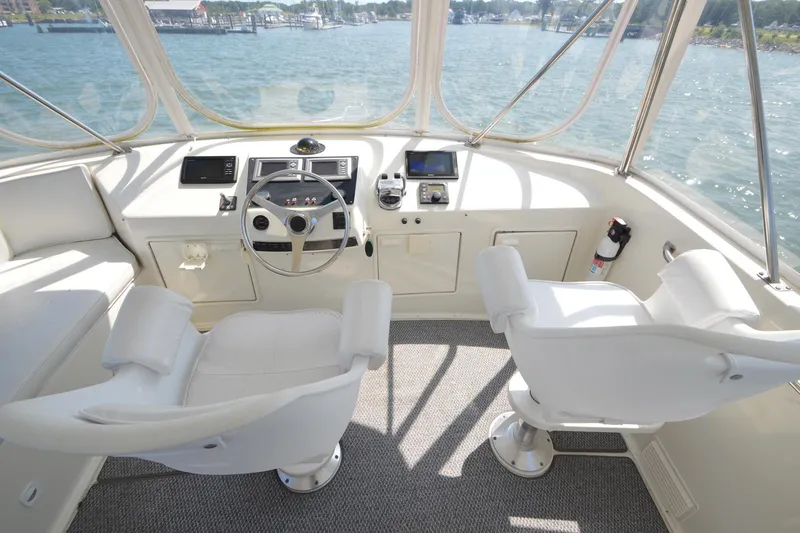 Slide: The Image of Cockpit of 1995 Ocean 48 Cockpit Motor Yacht with steering wheel and navigation equipment. - 78