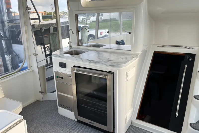 Slide: The Image of Interior of 1995 Ocean 48 Cockpit Motor Yacht with kitchenette and modern appliances. - 41
