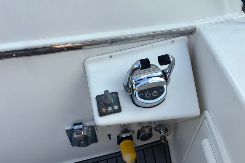 Slide: The Image of Control panel of a 1995 Ocean 48 Cockpit Motor Yacht with throttle and joystick. - 47