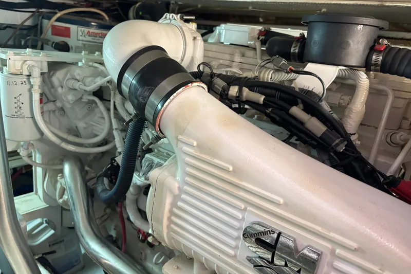 Slide: The Image of Engine room of 1995 Ocean 48 Cockpit Motor Yacht with Cummins engine components. - 53