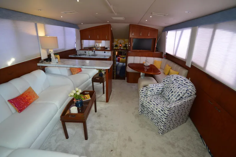 Slide: The Image of Luxurious interior of a 1995 Ocean 48 Cockpit Motor Yacht with elegant seating and decor. - 5