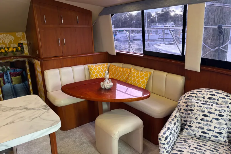 Slide: The Image of Interior of 1995 Ocean 48 Cockpit Motor Yacht with cozy seating and nautical decor. - 8