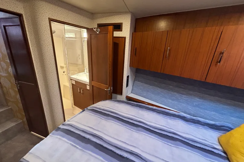 Slide: The Image of Interior of 1995 Ocean 48 Cockpit Motor Yacht with bedroom and bathroom view. - 22