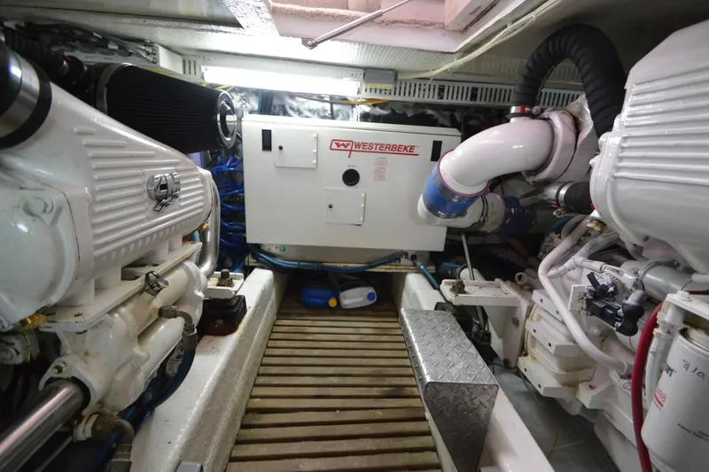 Slide: The Image of Engine room of 1995 Ocean 48 Cockpit Motor Yacht with Westerbeke generator. - 50