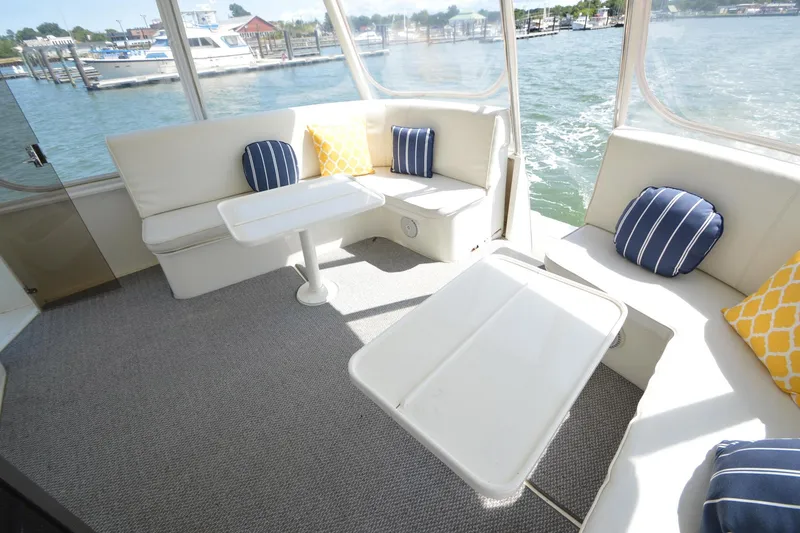 Slide: The Image of Luxurious 1995 Ocean 48 Cockpit Motor Yacht interior with plush seating and nautical decor. - 71