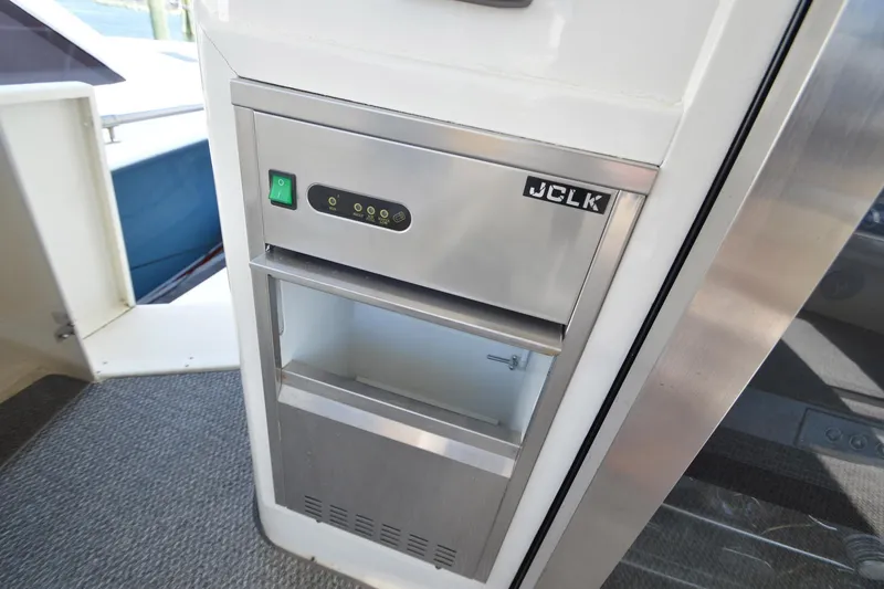 Slide: The Image of 1995 Ocean 48 Cockpit Motor Yacht interior with stainless steel appliance. - 58