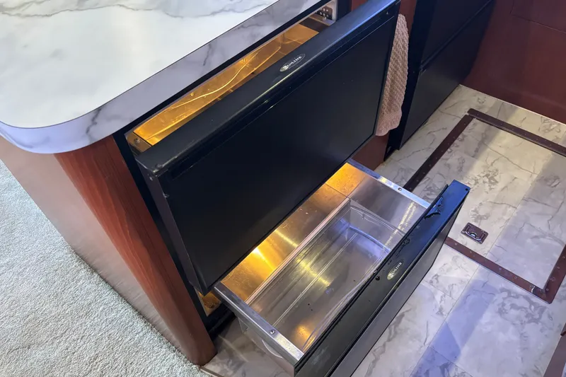 Slide: The Image of Open drawer refrigerator in 1995 Ocean 48 Cockpit Motor Yacht kitchen area. - 13