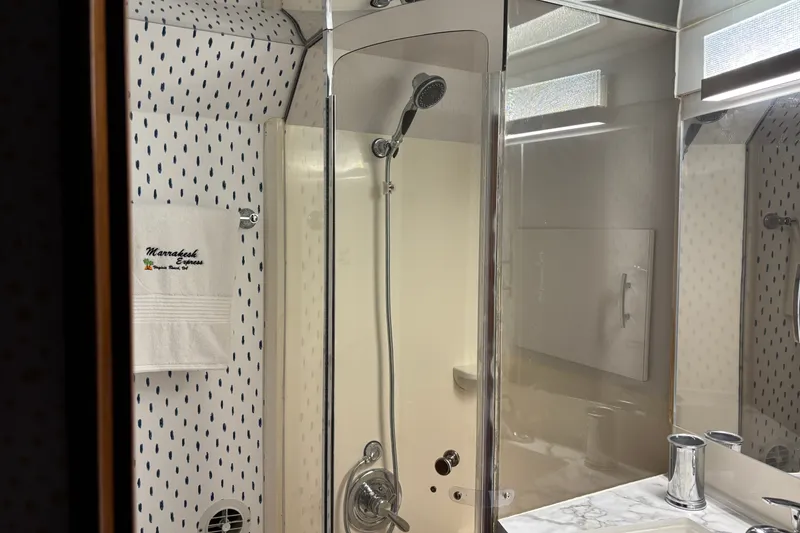 Slide: The Image of Bathroom interior of 1995 Ocean 48 Cockpit Motor Yacht with shower and towel. - 29