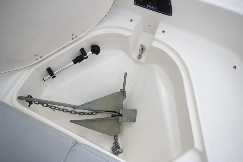 Slide: The Image of Anchor storage compartment on a 2014 Boston Whaler 210 Dauntless boat. - 11