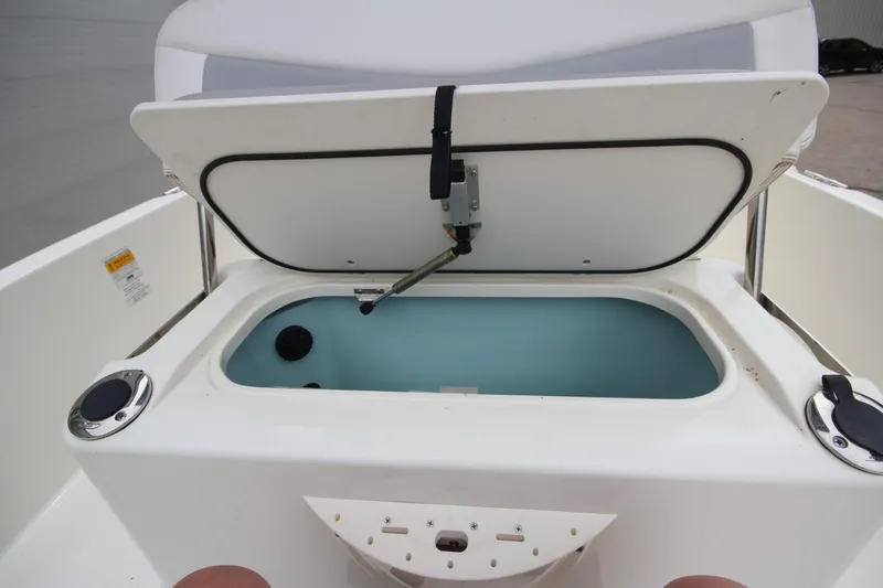 Slide: The Image of Open storage compartment on a 2014 Boston Whaler 210 Dauntless boat. - 15